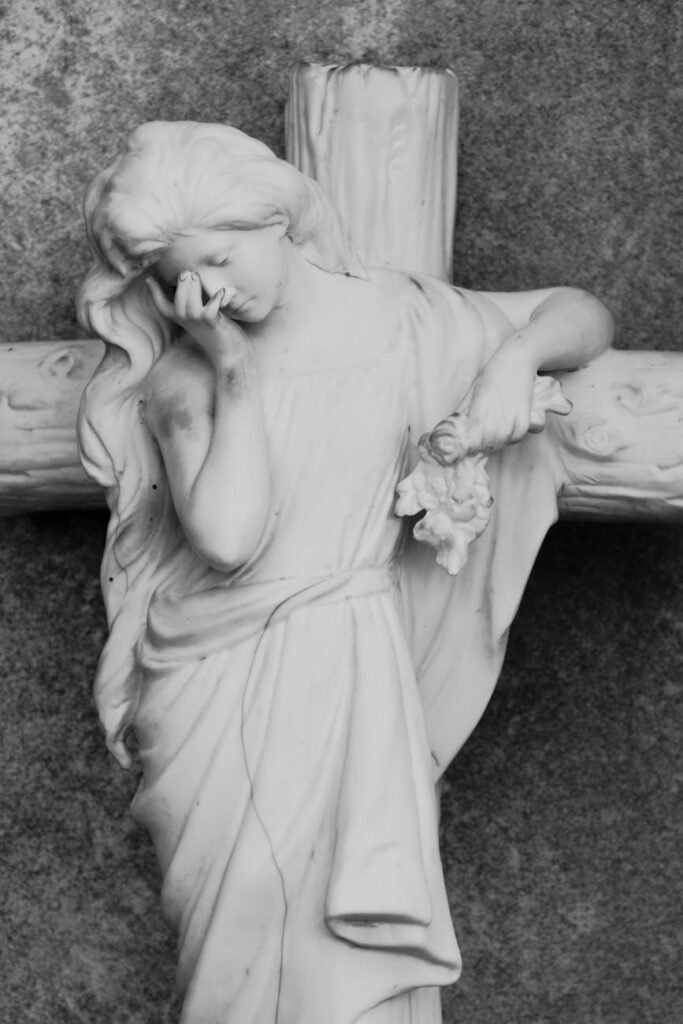 sculpture of saint crying on cross